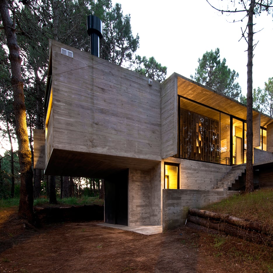 BAK Arquitectos nestles exposed concrete holiday home in forest glade