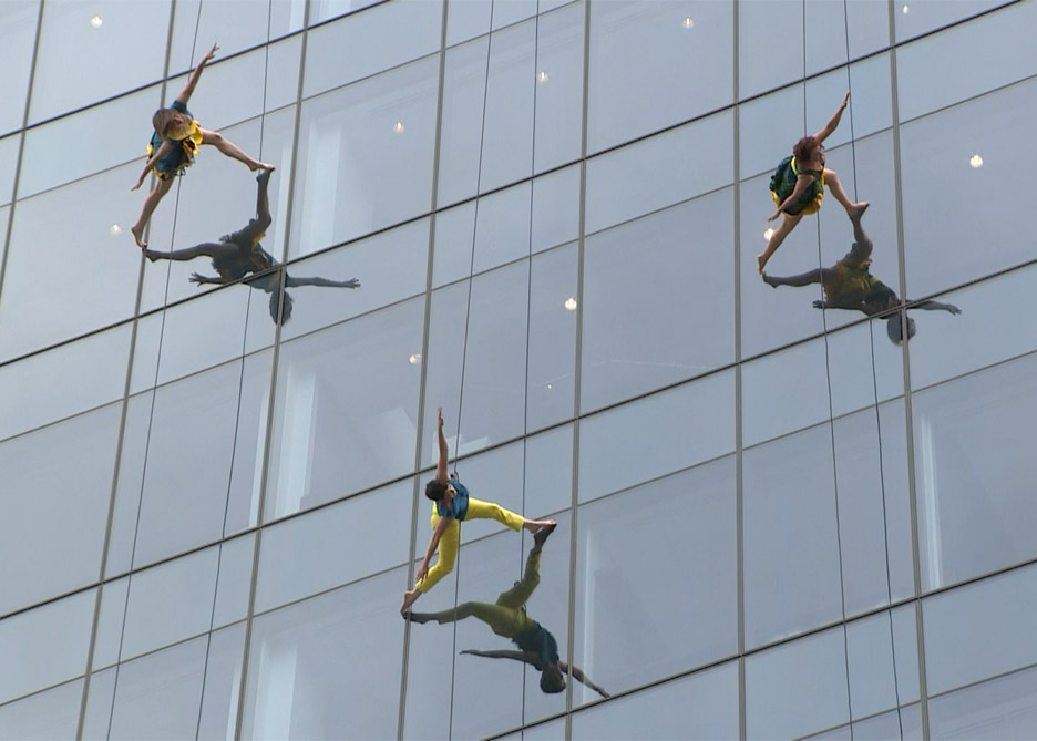 Mid-air dancing performance on the side of 100 North Avenue in Boston, Massachusetts, USA by Bandaloop