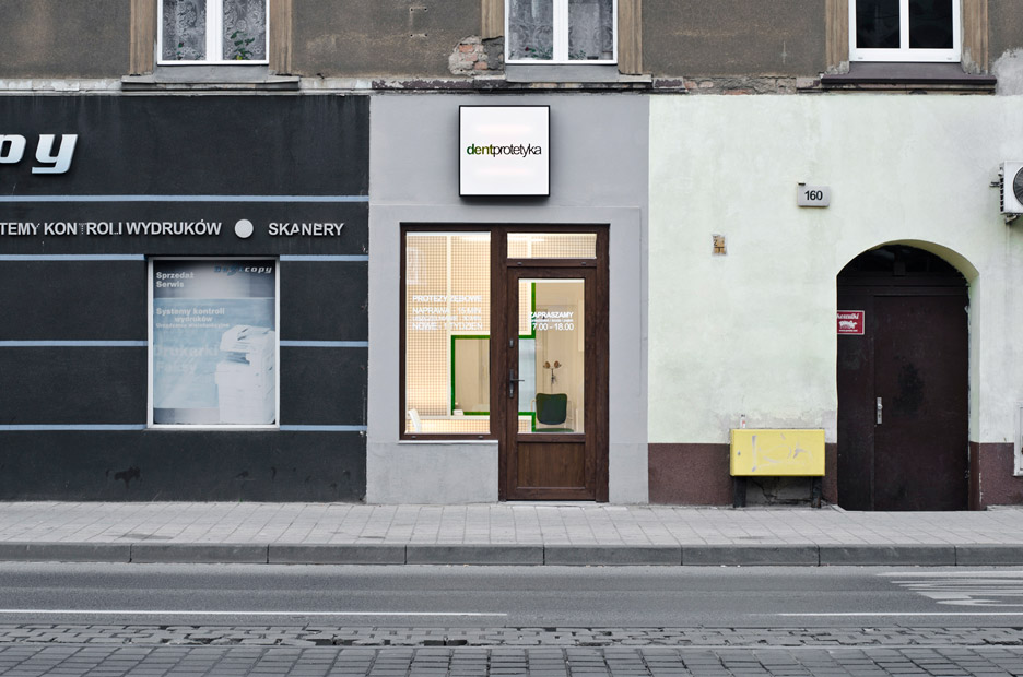 Adam Wiercinski creates denture clinic with green cross interior for Dent Protetyka