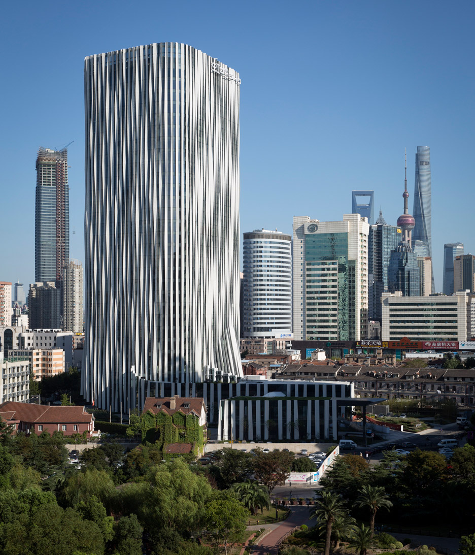 Strips of pleated aluminium are added to the facade of this Shanghai tower by Kengo Kuma