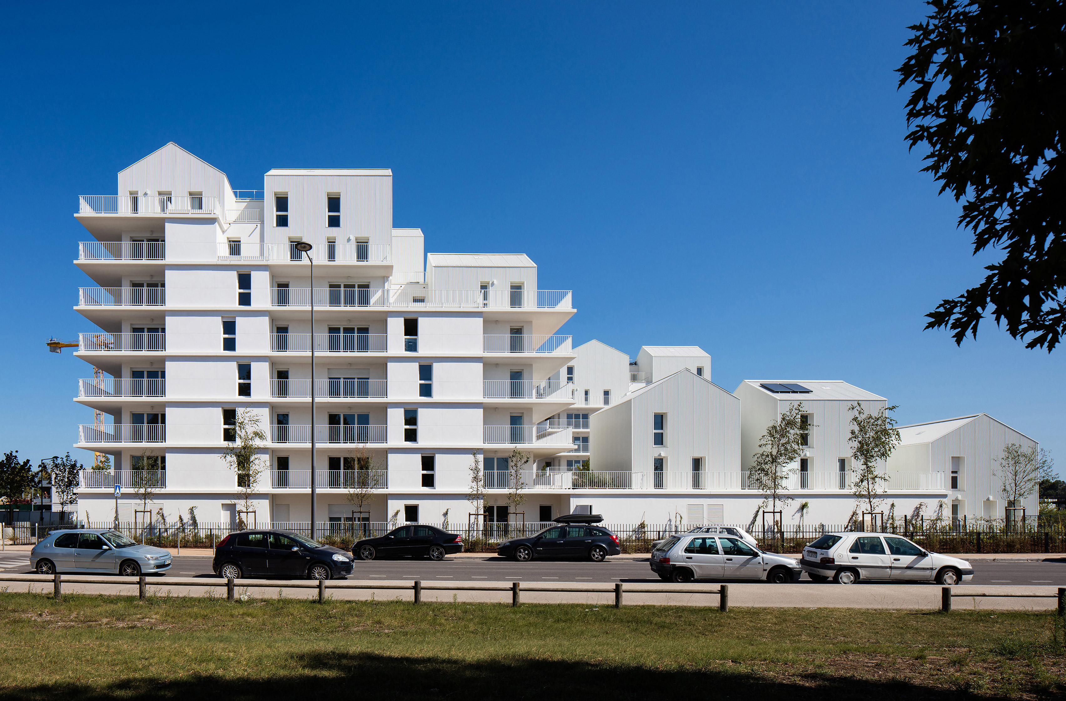 Gabled penthouses sit atop apartment blocks at Bordeaux housing scheme