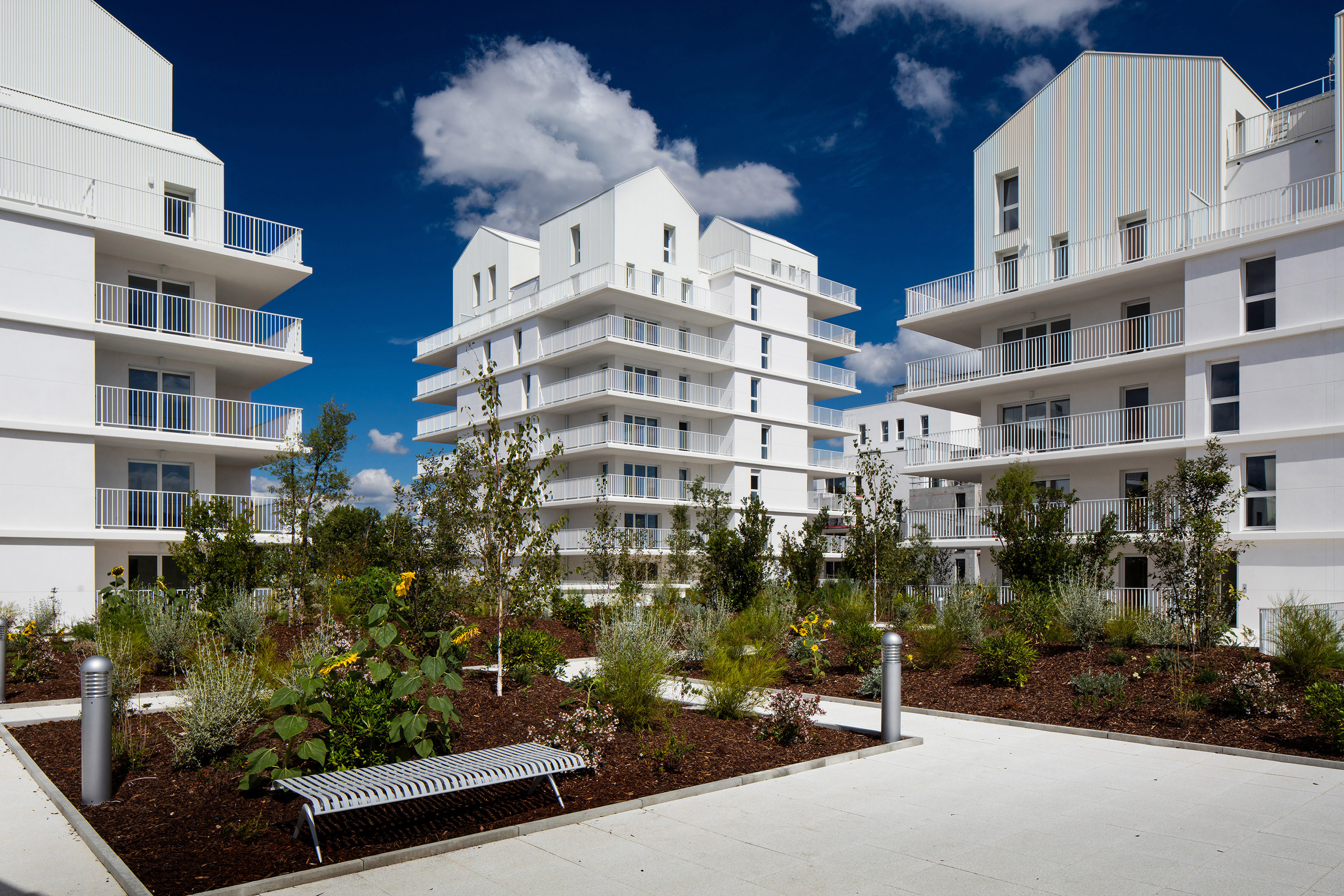 Gabled penthouses sit atop apartment blocks at Bordeaux housing scheme