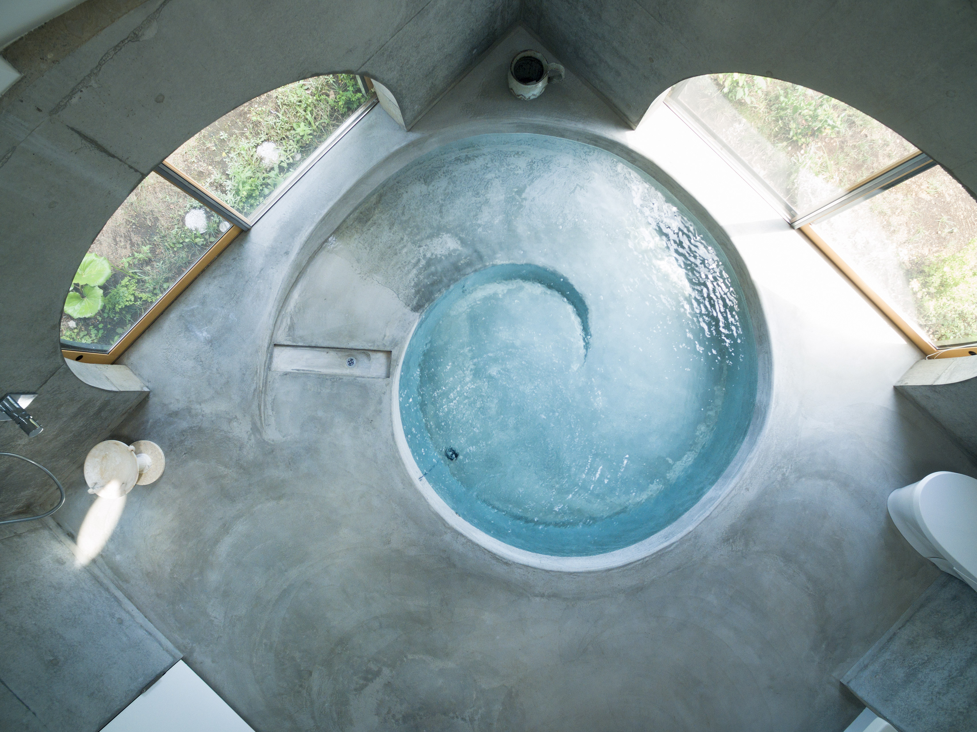 Teepee-shaped Jikka complex by Issei Suma features community kitchen and spiral-shaped pool