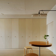 Tokyo apartment by Minorpoet features kitchen hidden behind folding doors