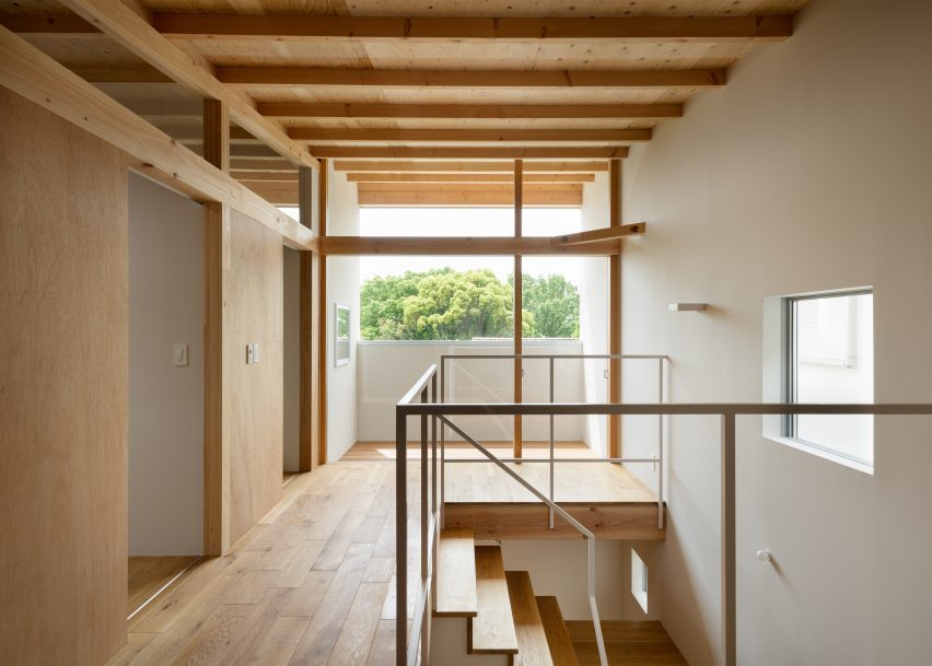 House In Mikage Contrasts White Surfaces With Exposed Wooden Beams