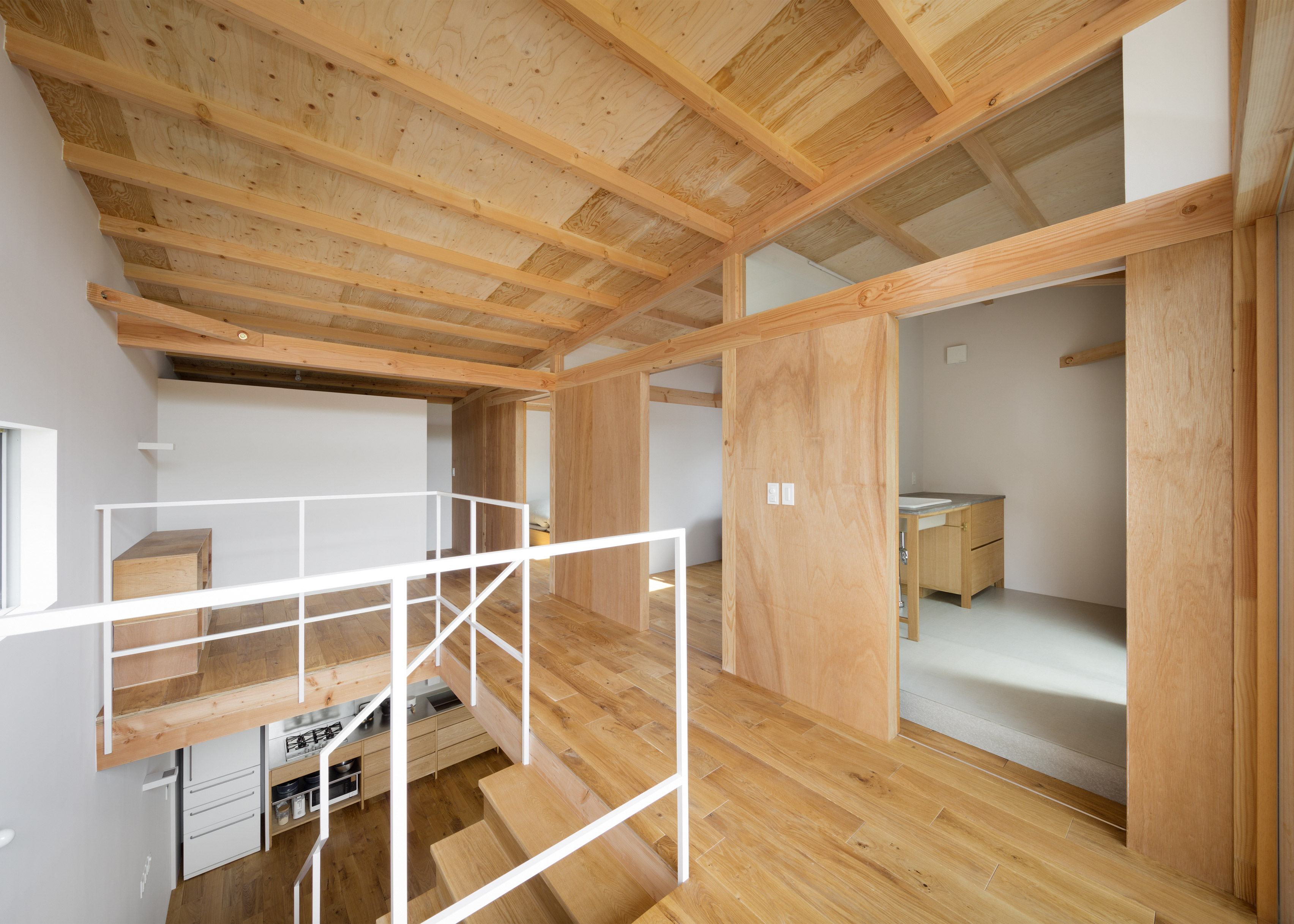 House In Mikage Contrasts White Surfaces With Exposed Wooden