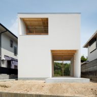House in Mikage by Sides Core contrasts white surfaces with exposed wooden beams