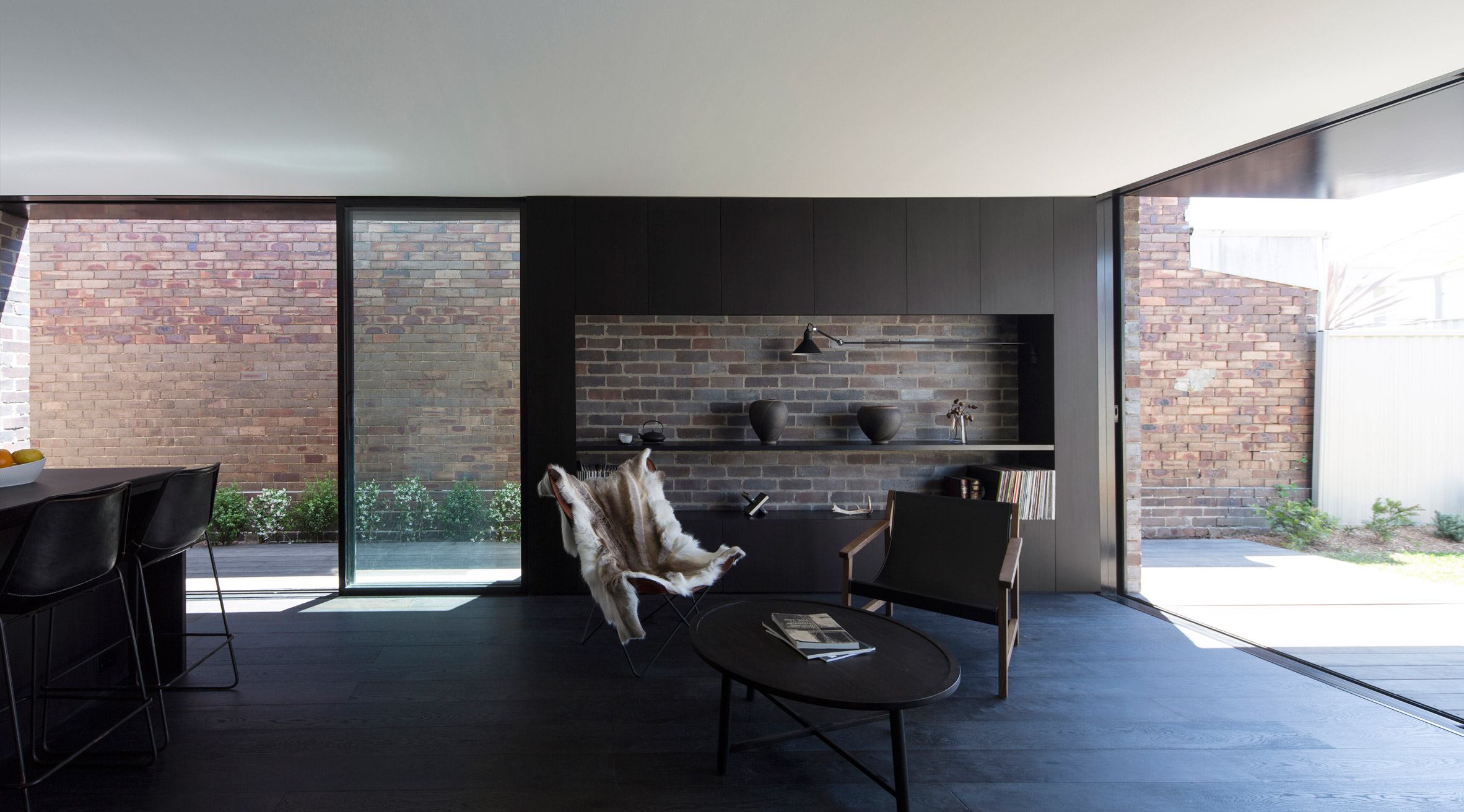 Studioplusthree adds contrasting black extension to white Federation house in Sydney