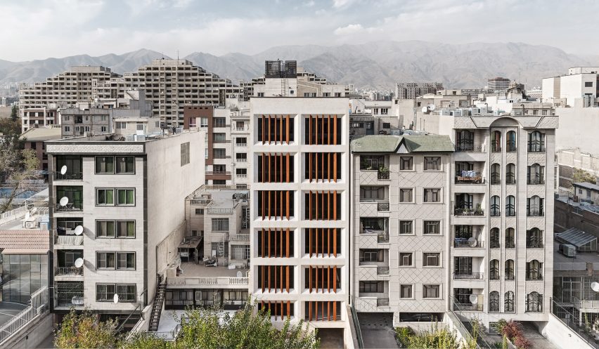 Tehran office building features facade divided into a grid of faceted window frames