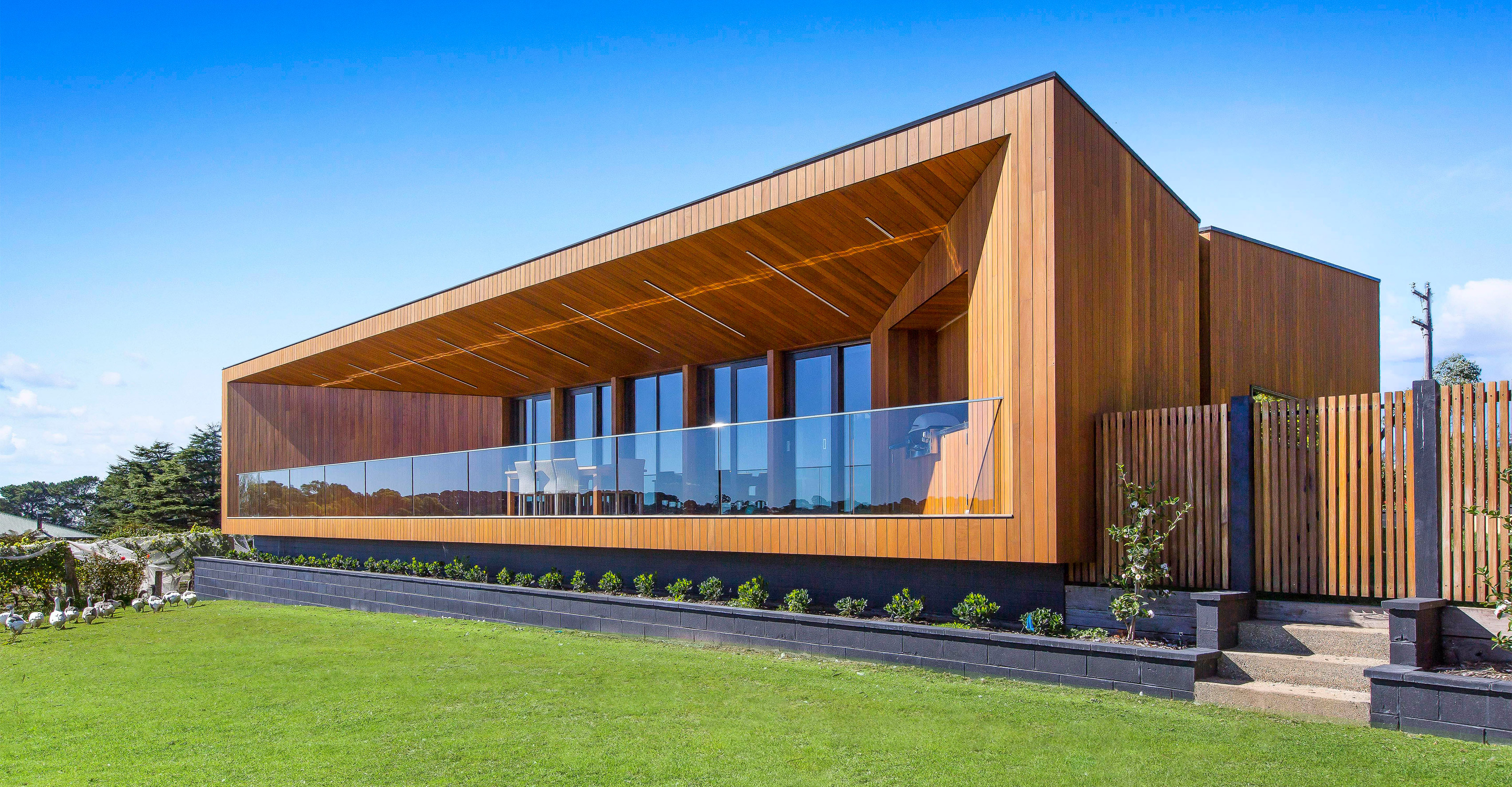 Red Hill Residence by Finnis Architects has a funnel-shaped deck overlooking a winery