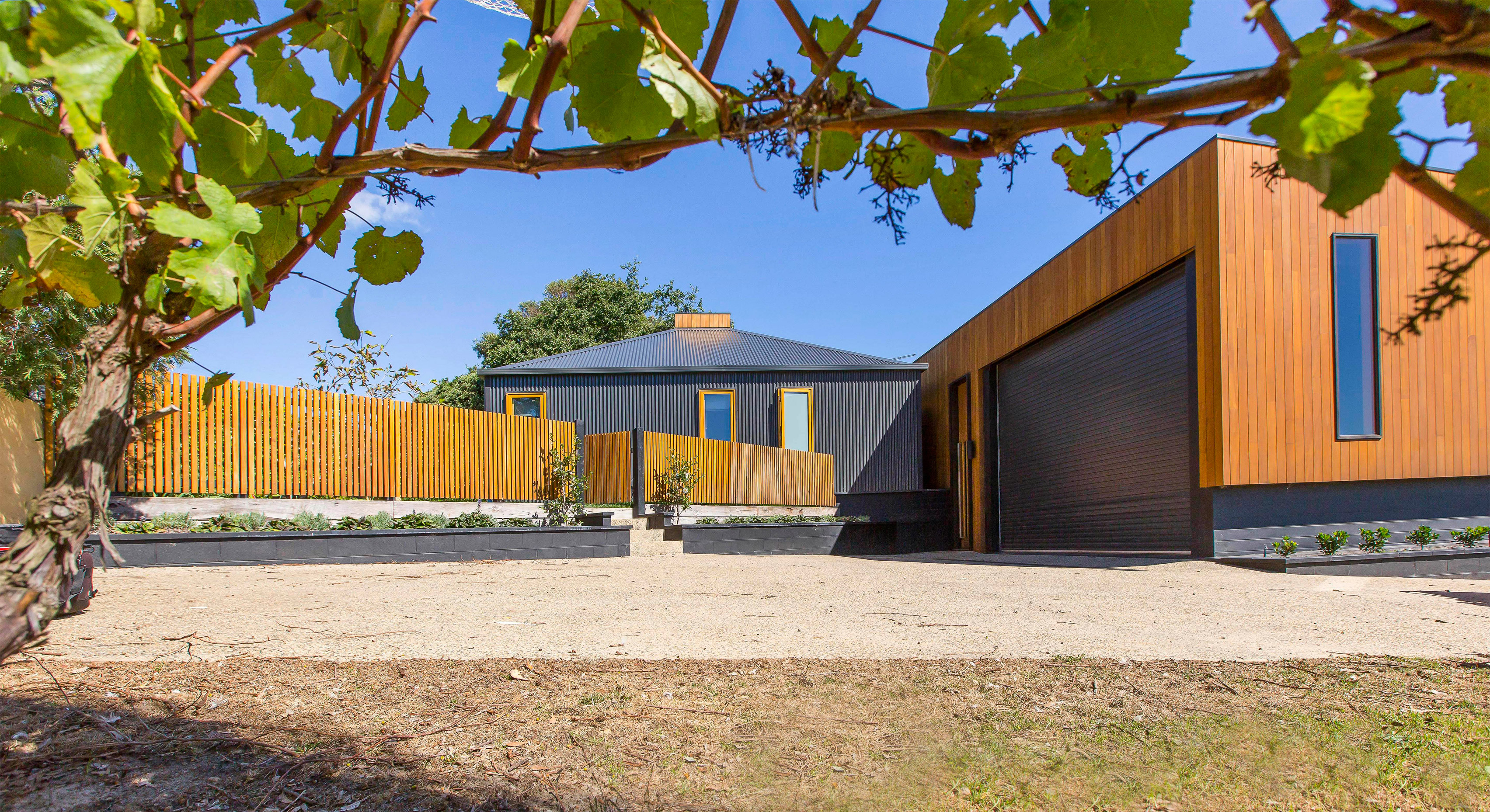 Red Hill Residence by Finnis Architects has a funnel-shaped deck overlooking a winery