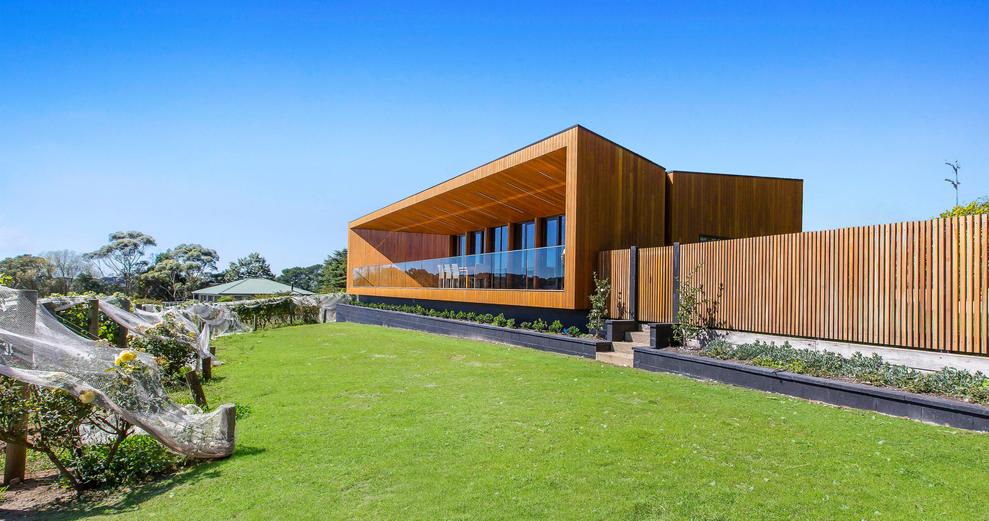 Red Hill Residence by Finnis Architects has a funnel-shaped deck overlooking a winery