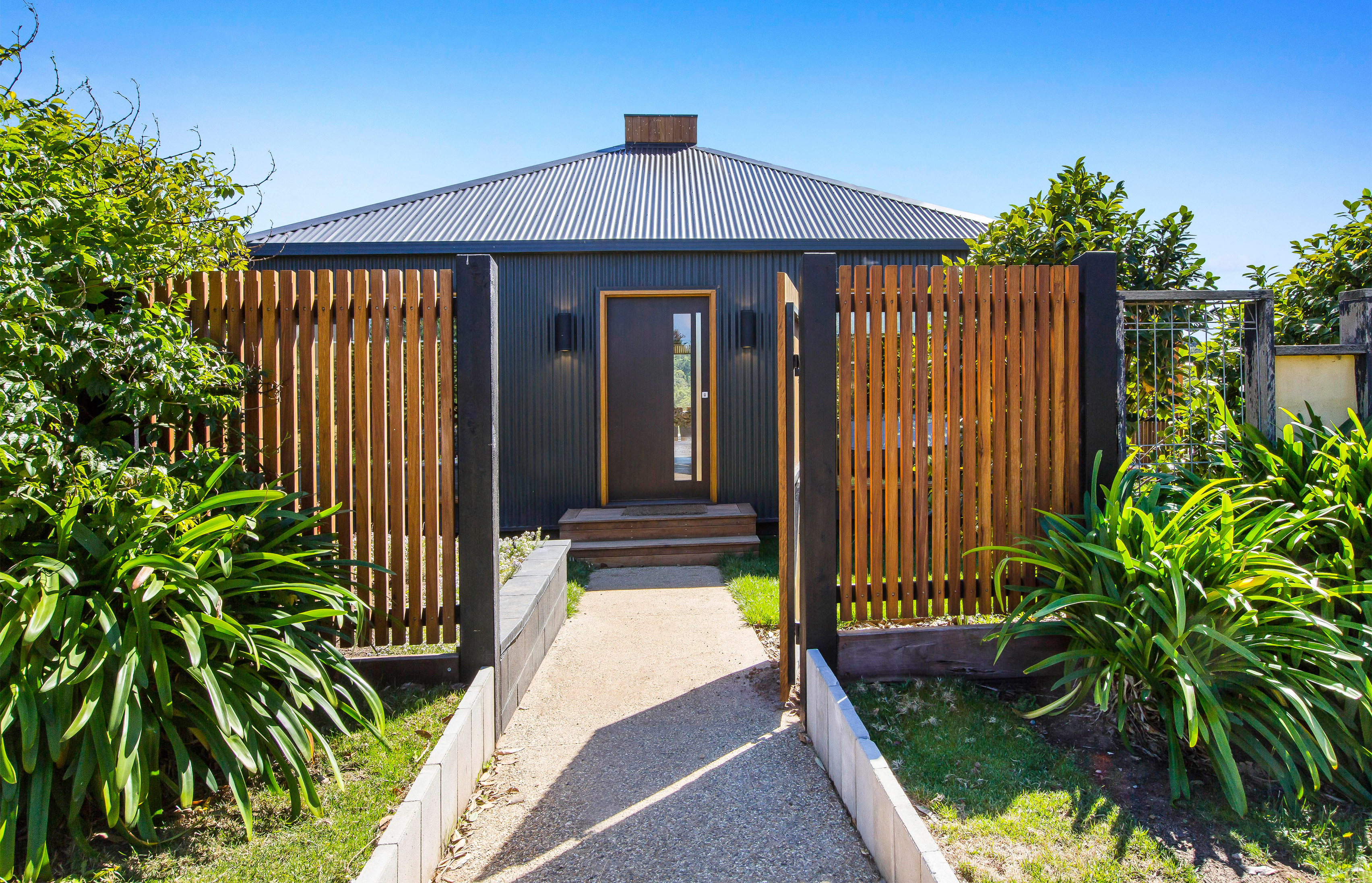 Red Hill Residence by Finnis Architects has a funnel-shaped deck overlooking a winery