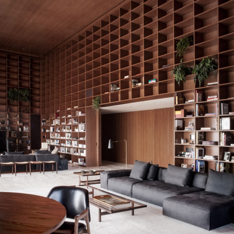 Studio MK27 creates giant shelving units in São Paulo penthouse