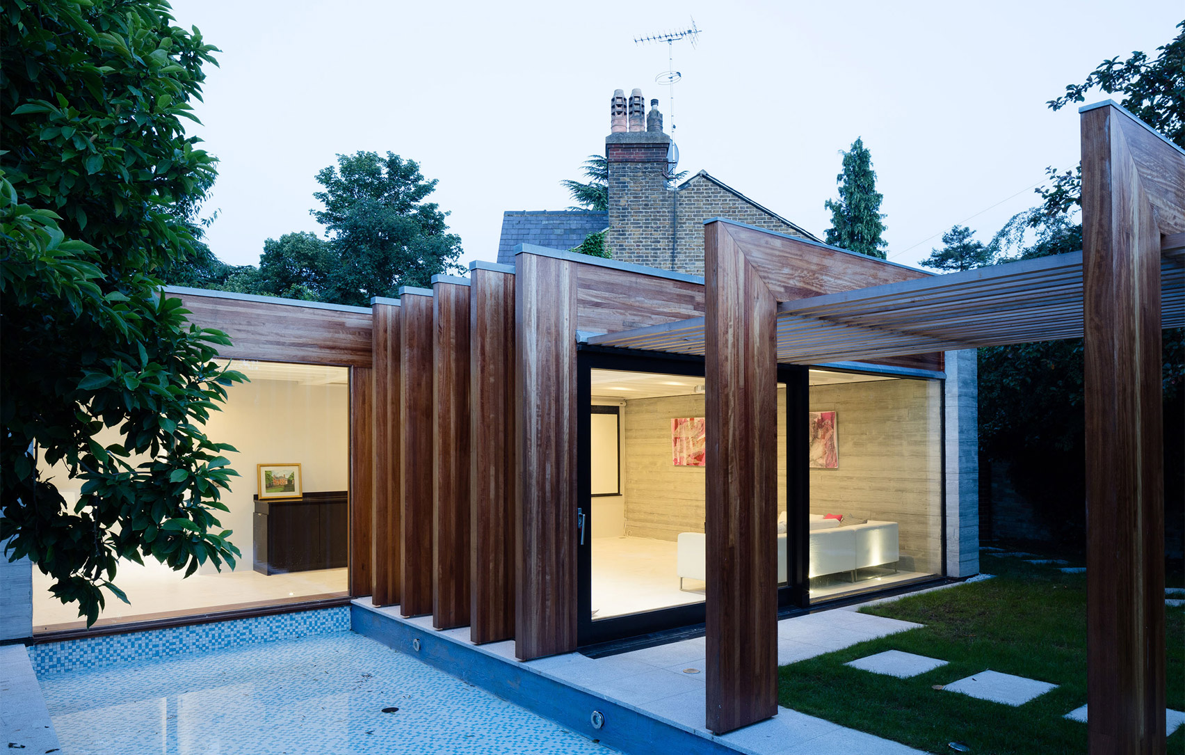 McGarry-Moon Architects adds concrete, timber and glass extension to a traditional gatehouse