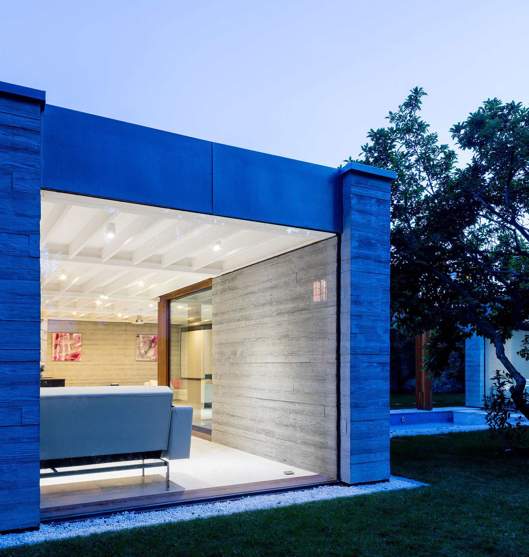 McGarry-Moon Architects adds concrete, timber and glass extension to a traditional gatehouse