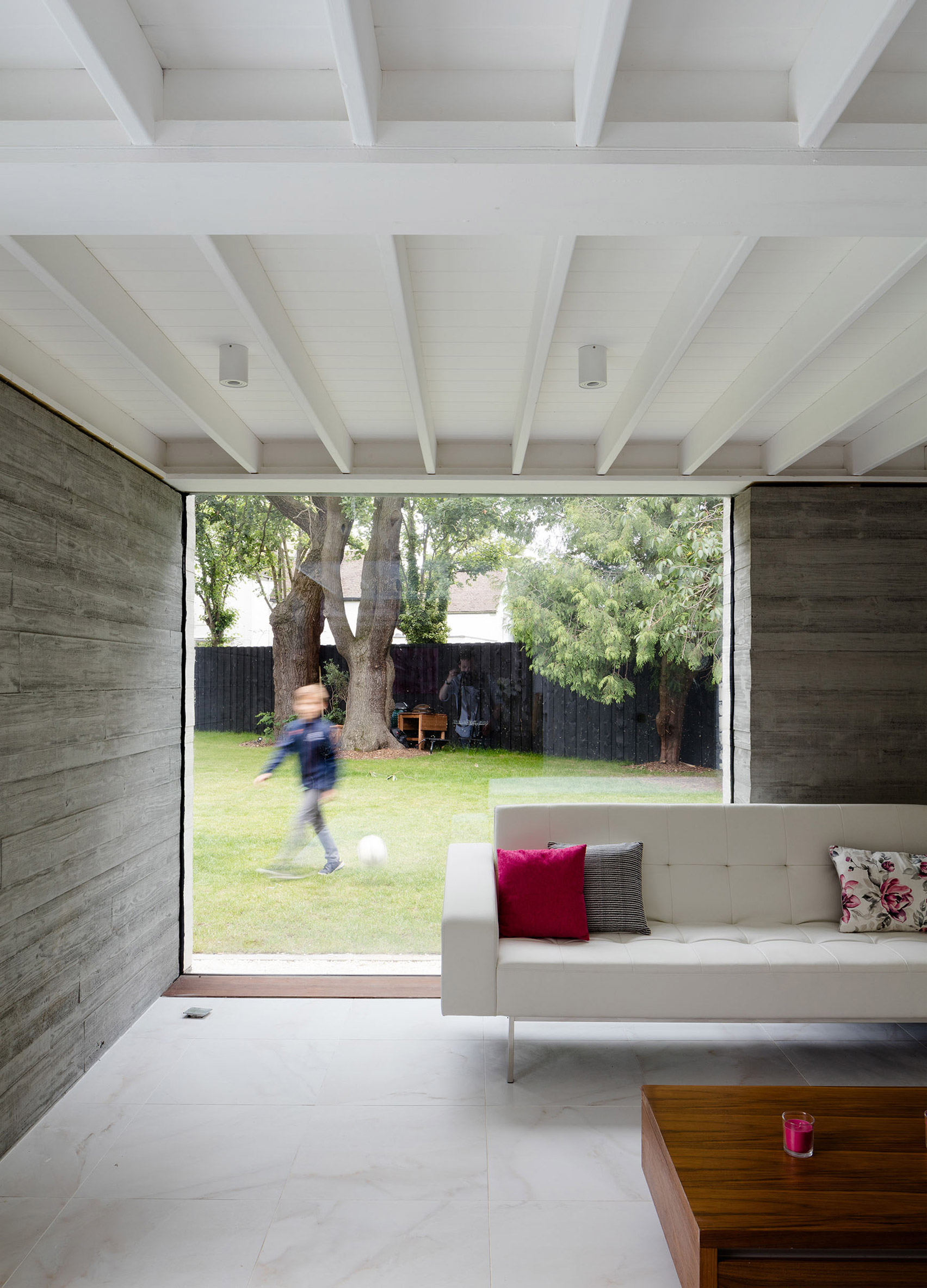 McGarry-Moon Architects adds concrete, timber and glass extension to a traditional gatehouse