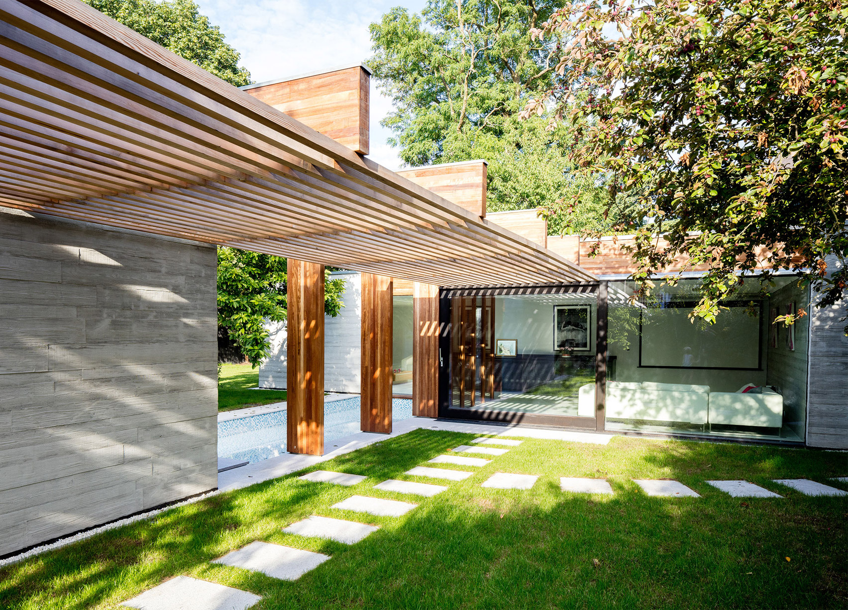 McGarry-Moon Architects adds concrete, timber and glass extension to a traditional gatehouse