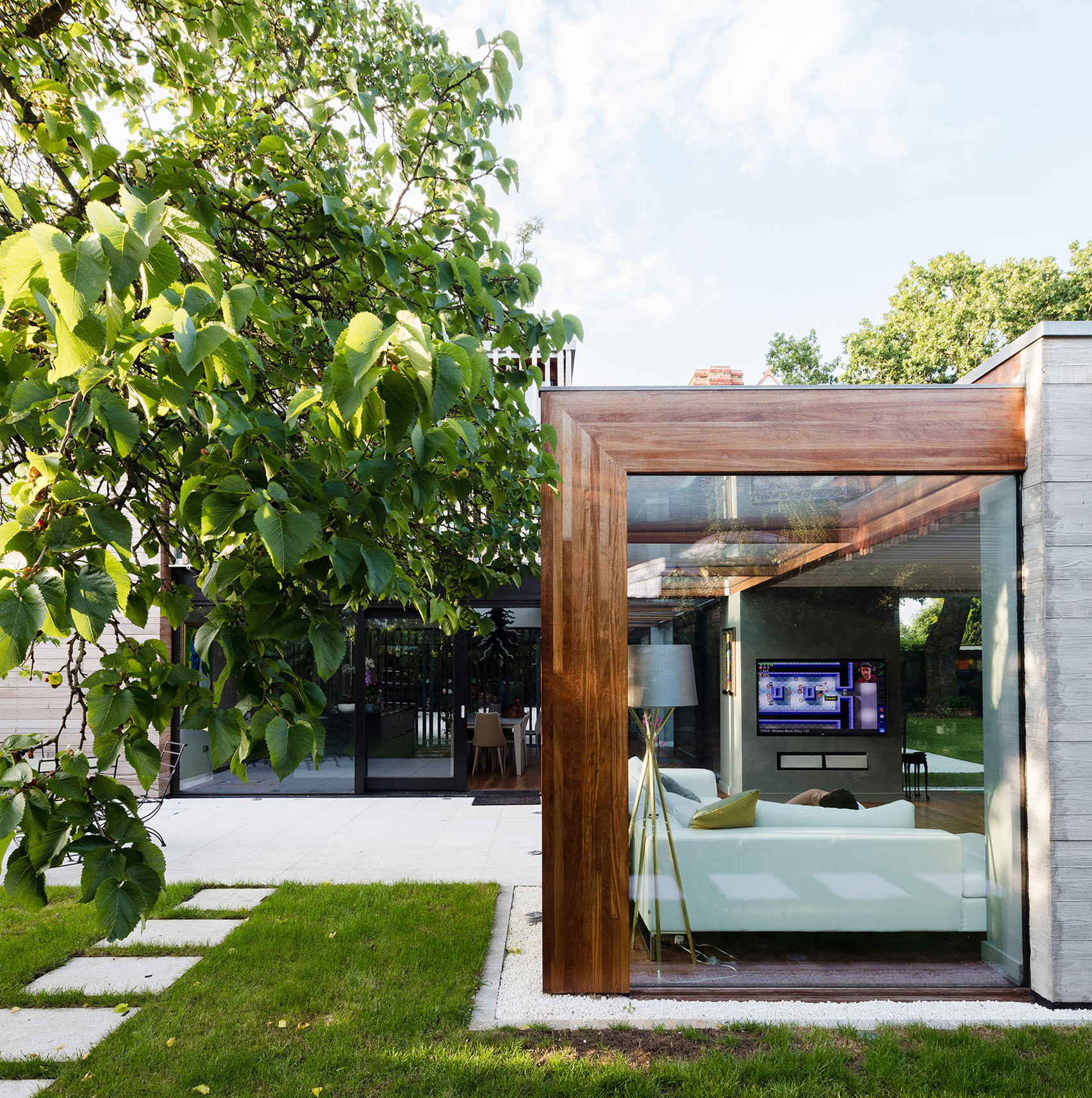 McGarry-Moon Architects adds concrete, timber and glass extension to a traditional gatehouse