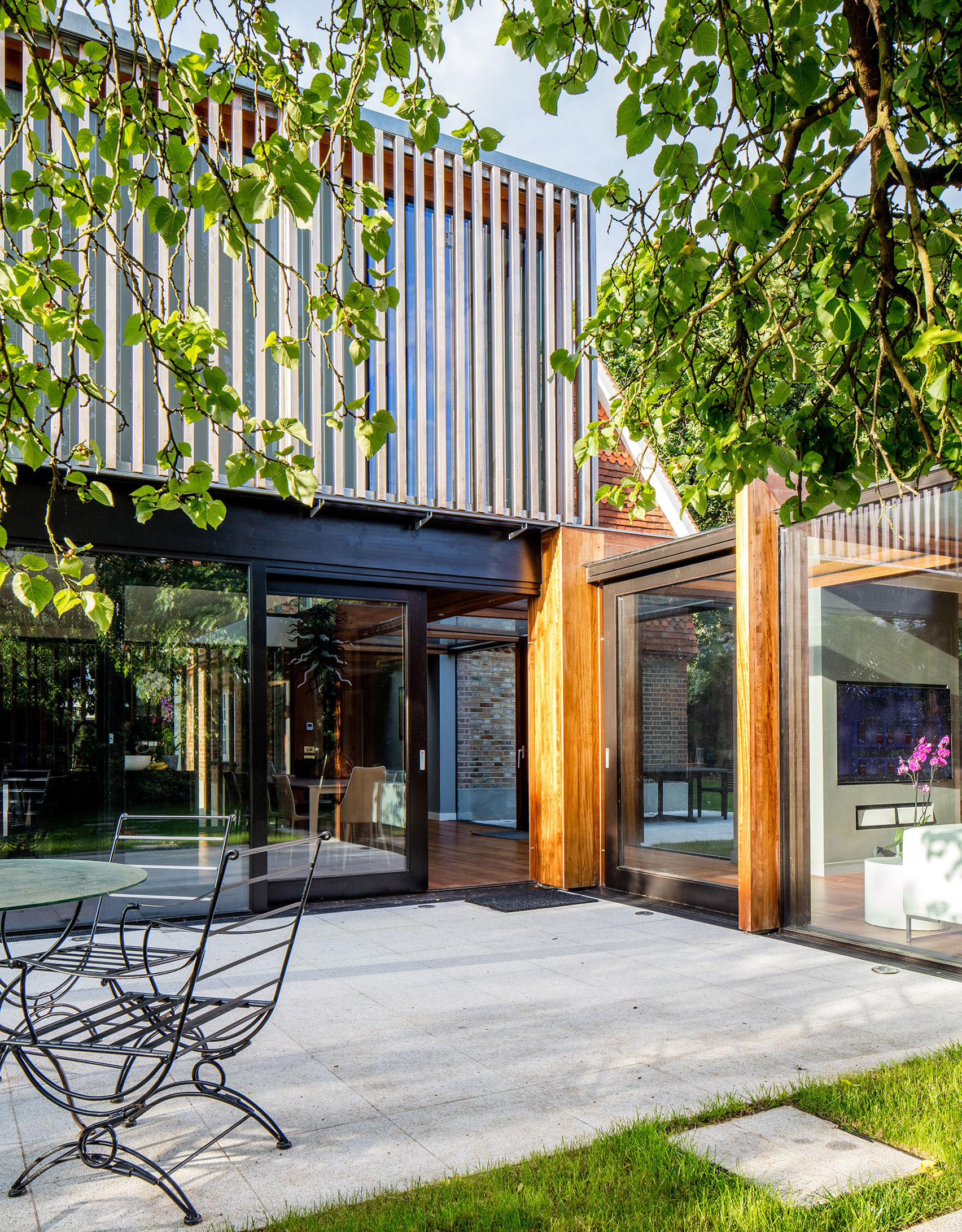 McGarry-Moon Architects adds concrete, timber and glass extension to a traditional gatehouse