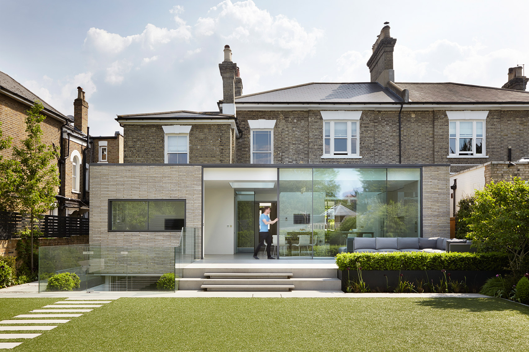 Studio Octopi adds glass-fronted extension to White Lodge house in London