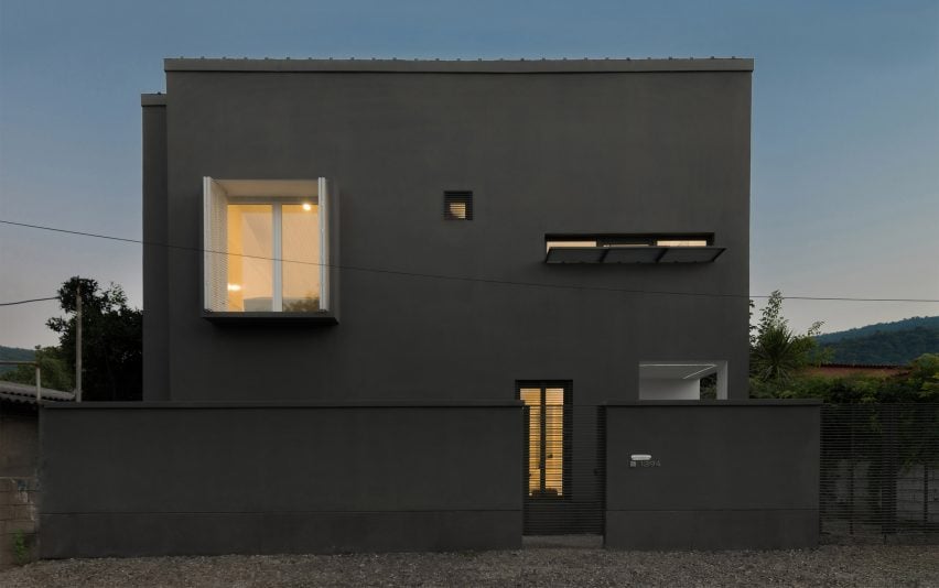 Iranian holiday home by RooyDaad Architects is black on the outside and white on the inside