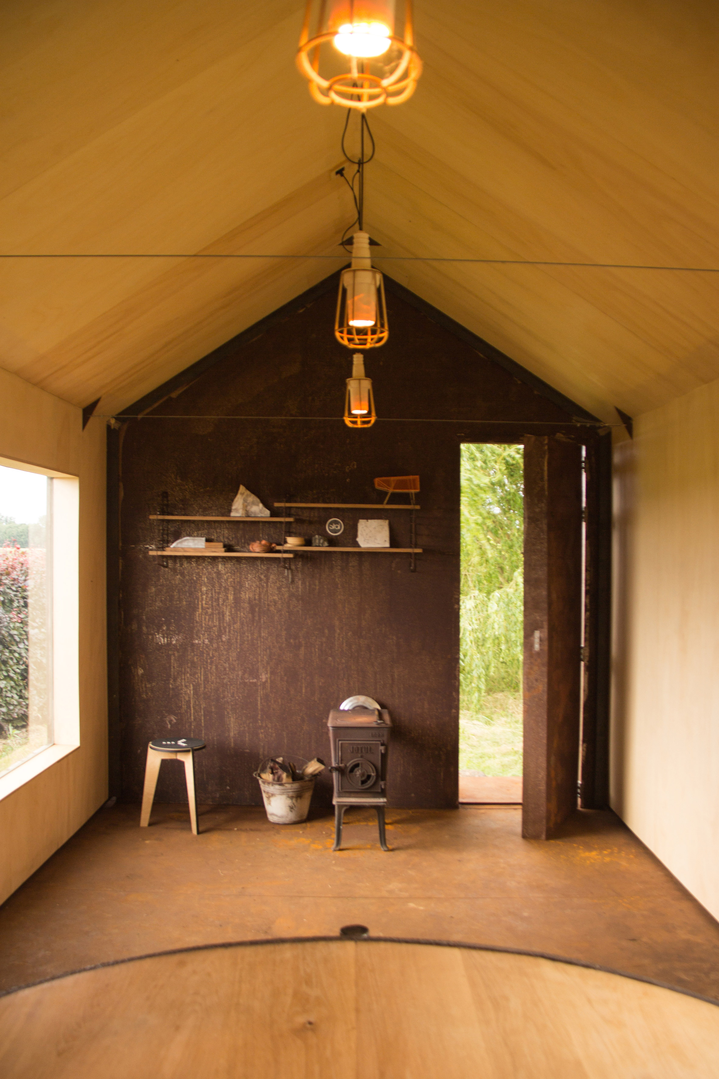 Moving walls open Stal Collectief's charred timber workshop to the elements