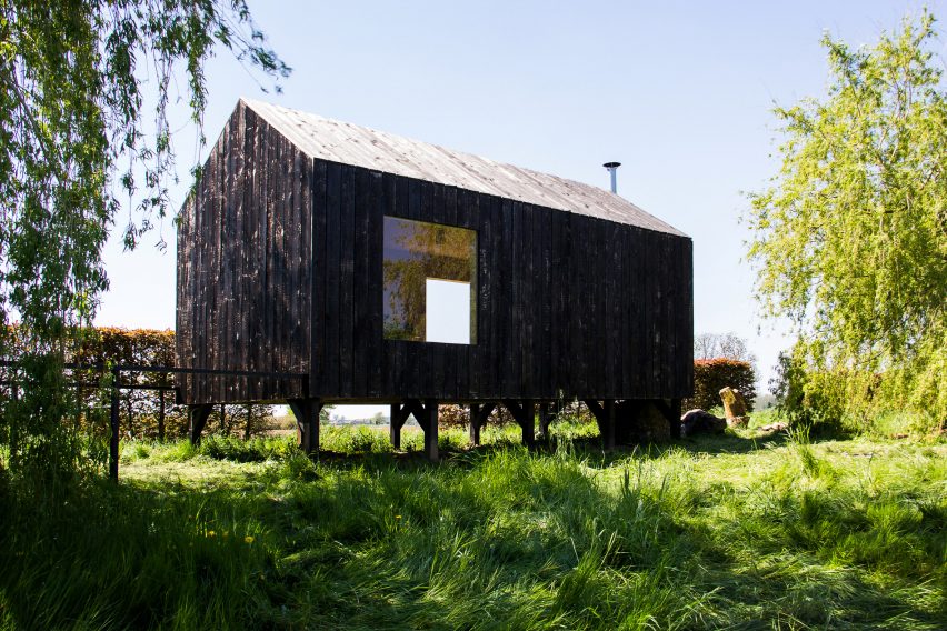 Moving walls open Stal Collectief's charred timber workshop to the elements