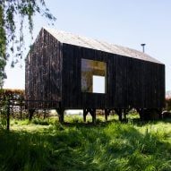 Moving walls open Stal Collectief's charred timber workshop to the elements