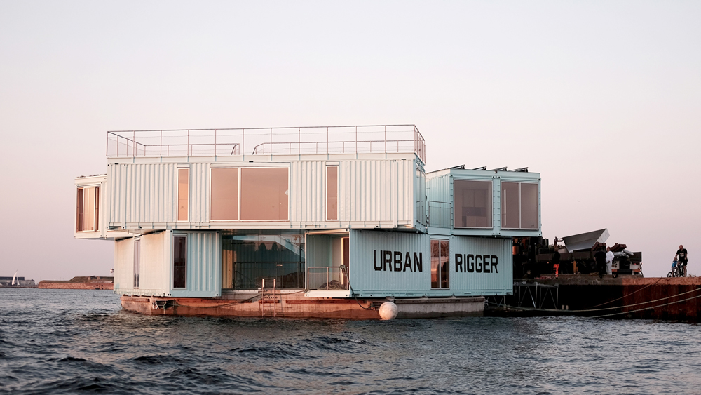 https://static.dezeen.com/uploads/2016/09/urban-rigger-bjarke-ingels-kim-loudrup-floating-student-houses_dezeen_social.jpg