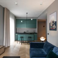 Colourful accents offset grey walls in Vilnius apartment renovation by AKTA