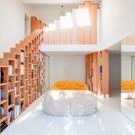 Stepped shelving creates extra storage in Bookshelf House by Andrea Mosca