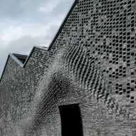 Bricklaying robots create bulging brick facade for Shanghai arts centre
