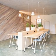 Collective workspace in Melbourne features plank-covered walls and bespoke furniture