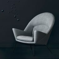 Carl Hansen & Søn adds black frame to Hans J Wegner lounge chairs
