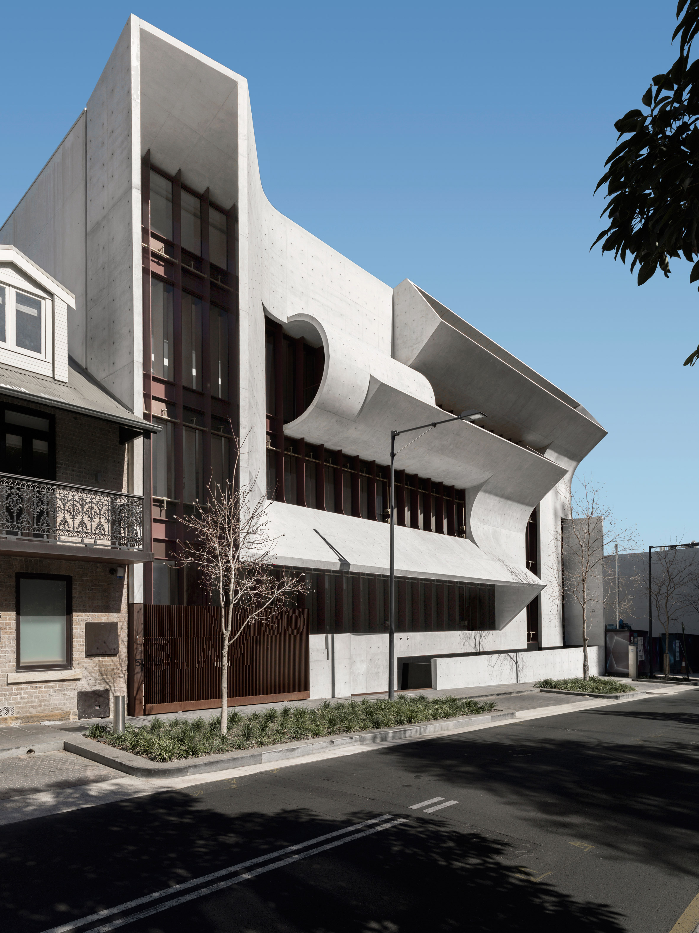 Sculptural facade directs daylight into Smart Design Studio's house