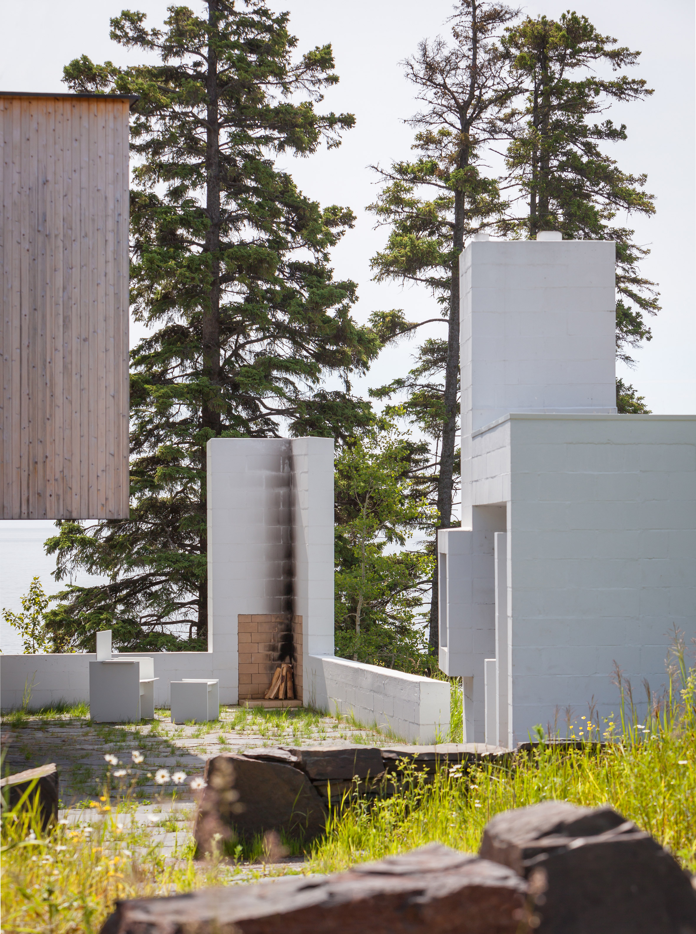 White masonry sauna defines courtyard in Minnesota retreat