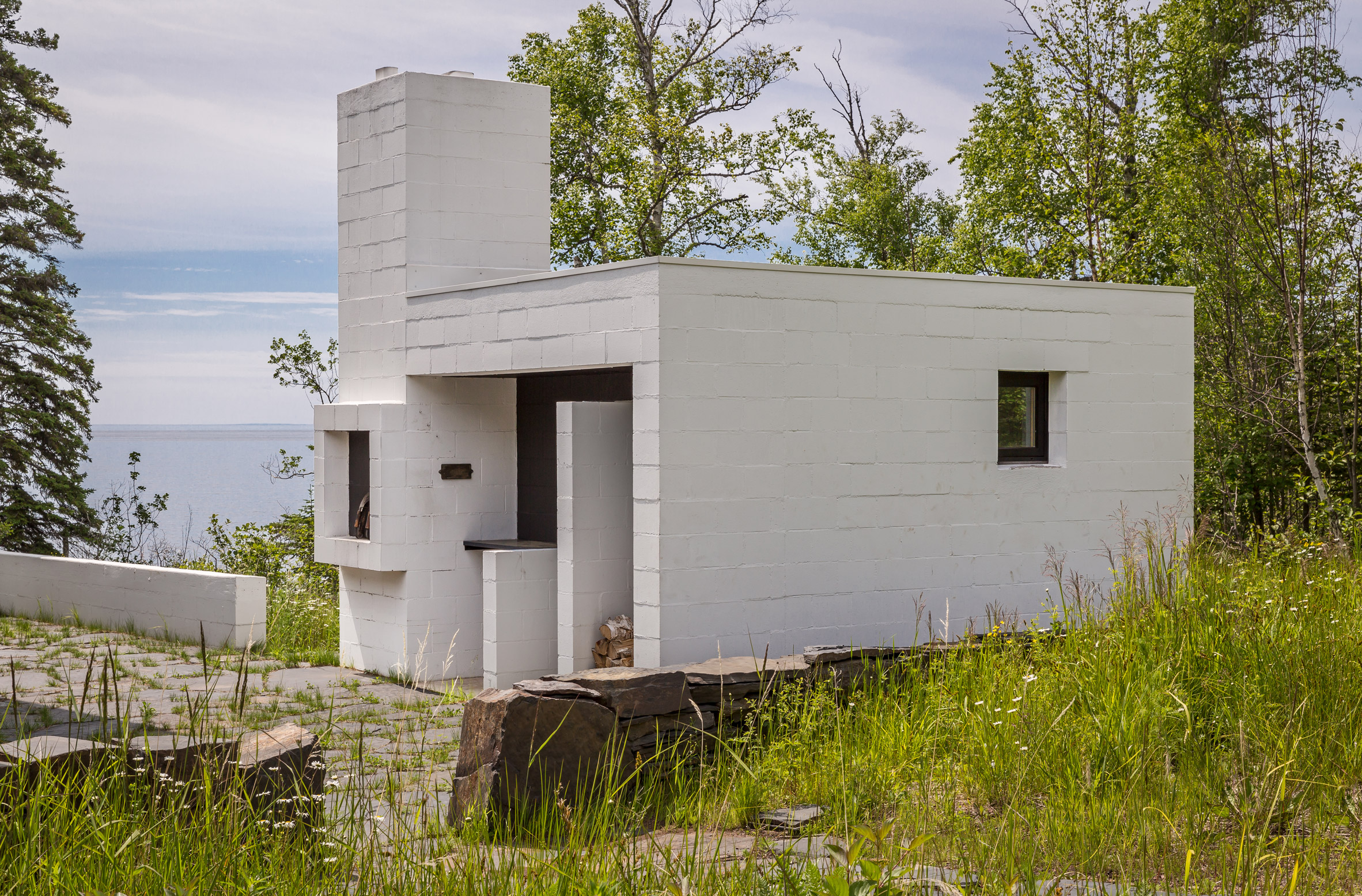 White masonry sauna defines courtyard in Minnesota retreat