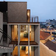 Concrete apartments slot into cliff overlooking Porto's Dom Lu&iacute;s I Bridge