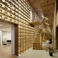 Giant bookcase forms centrepiece of Shanghai sales office by Team_Bldg