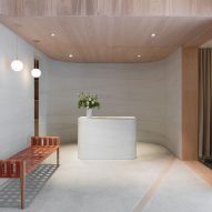 Striated concrete partitions create fitting rooms at Thakoon's first boutique