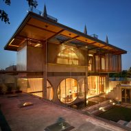 Circular windows and pyramidal skylights add playful geometry to Indonesian home
