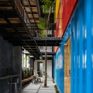 Stacked shipping containers house bedrooms at Vietnam hostel by TAK Architects