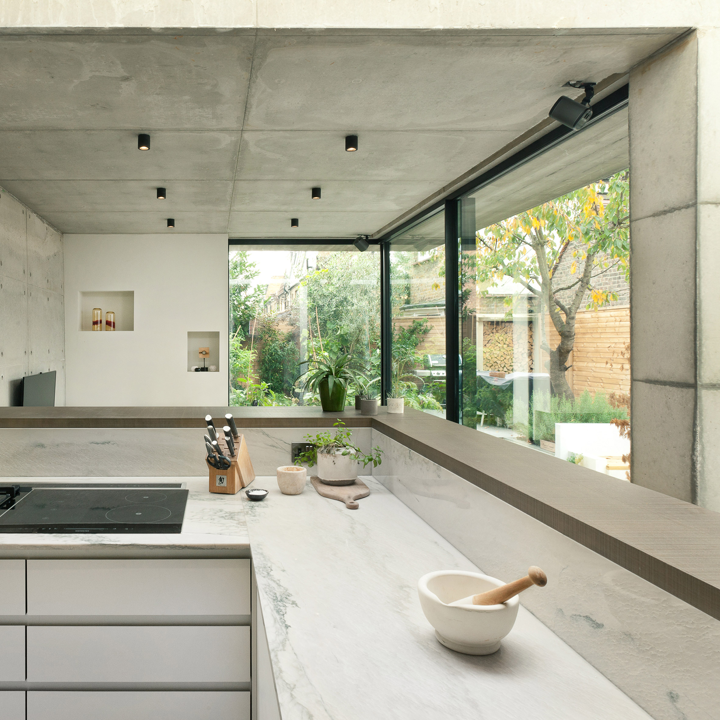 double-concrete-house-inter-urbans-studios-dont-move-improve-architecture_dezeen_sq