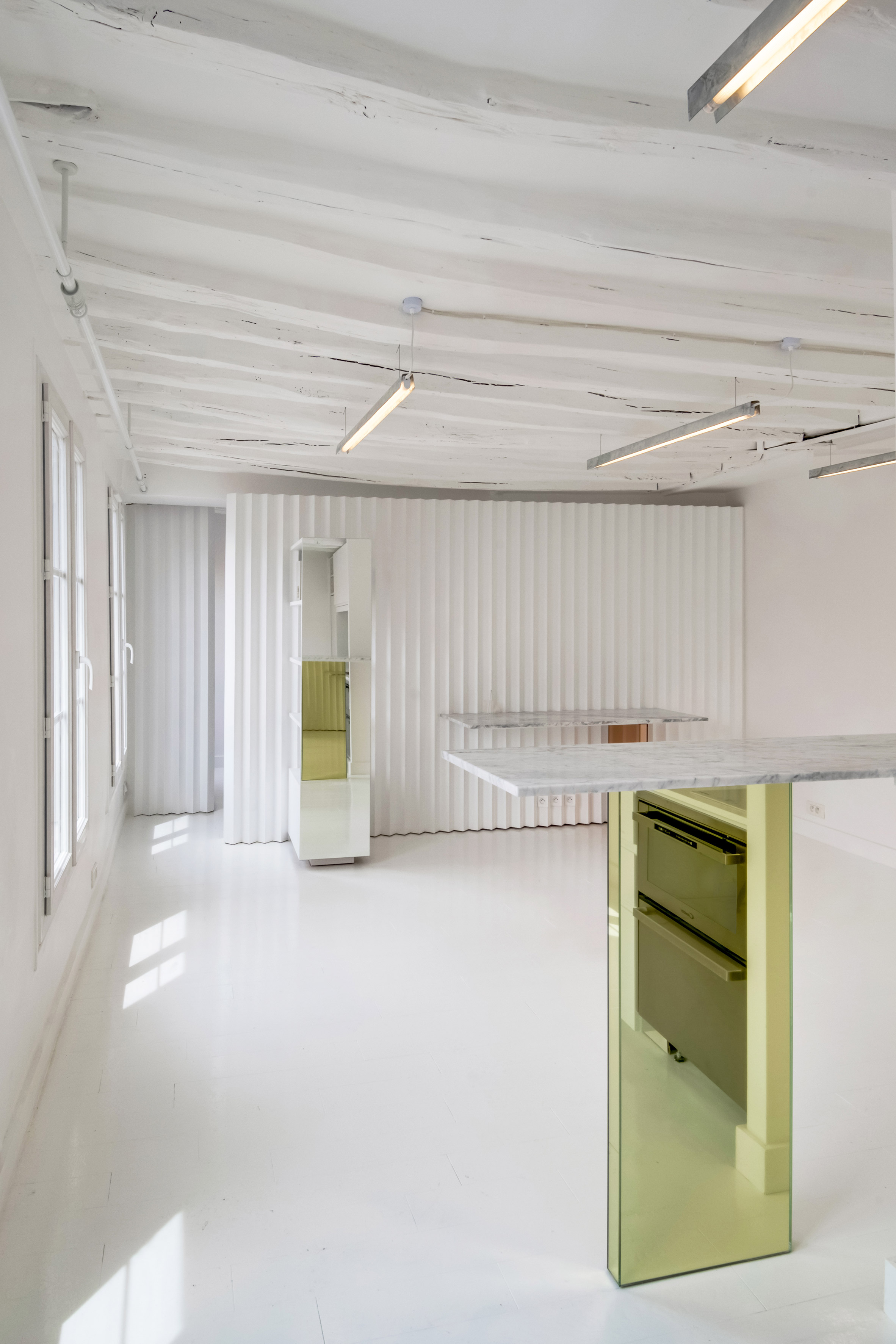 Ubalt Architectes creates compositions with custom furniture in minimalist Paris flat