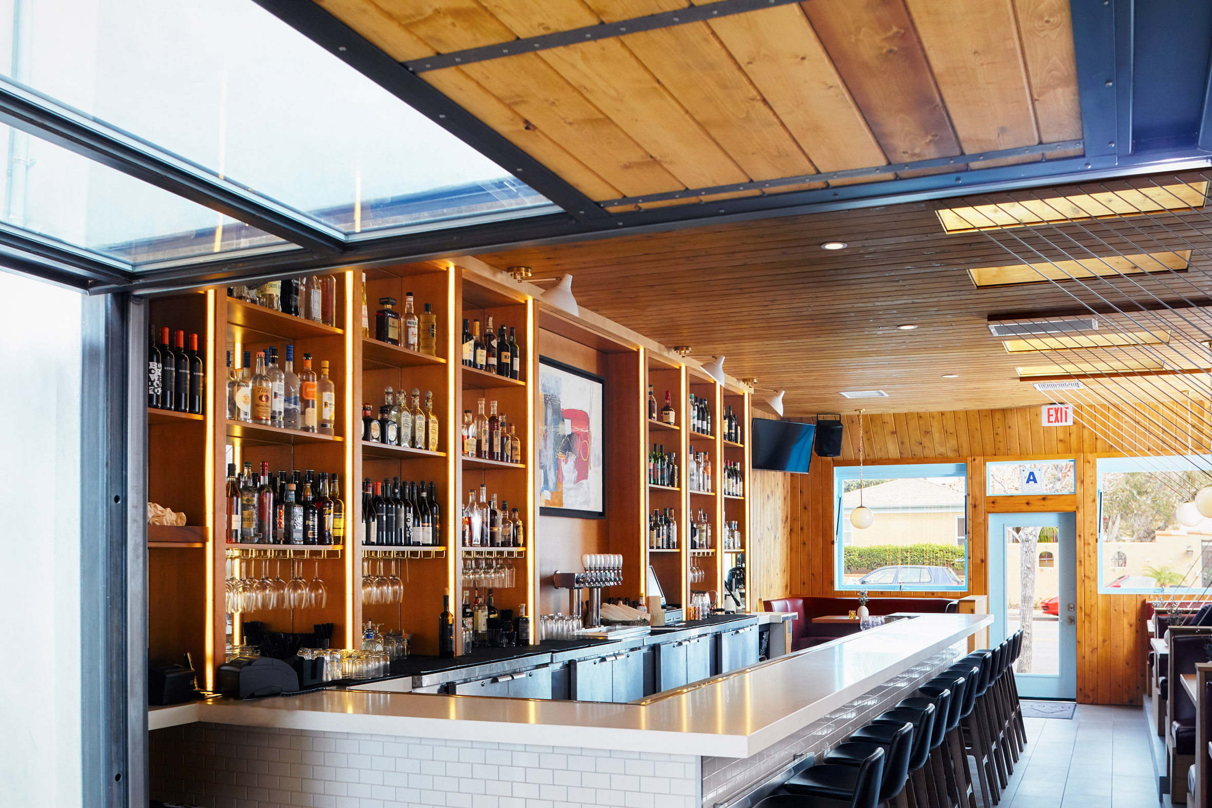 Cedar-clad ceiling arches over San Diego restaurant by Archisects