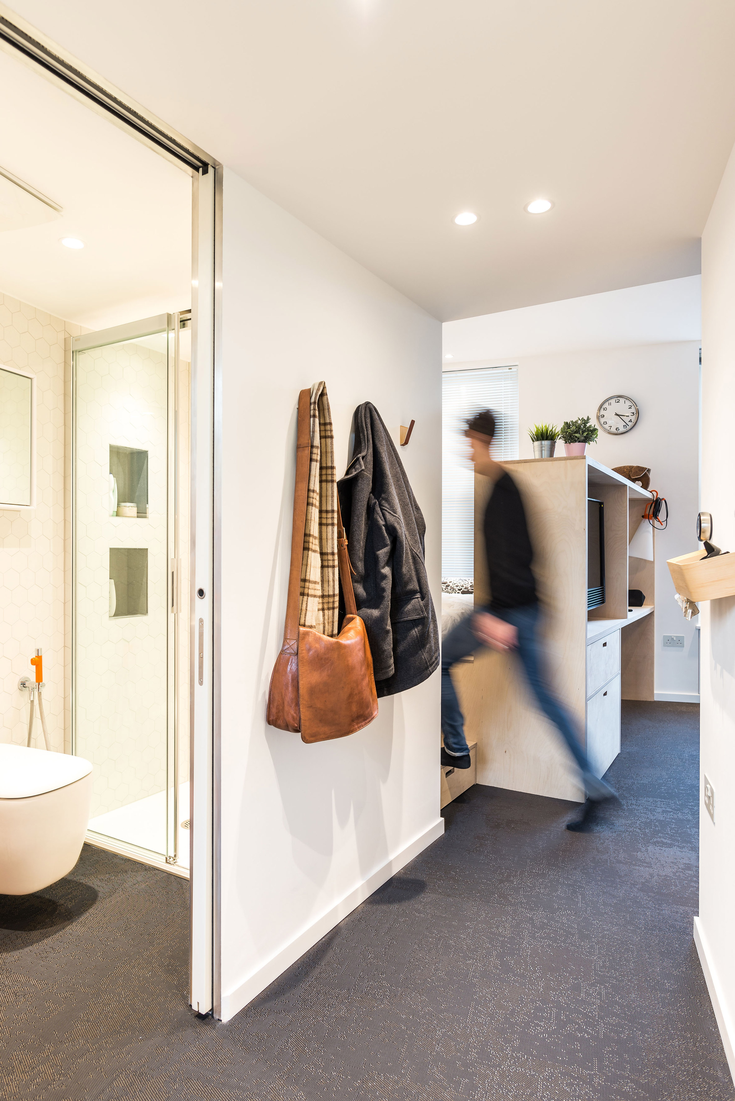 CIAO adds space-saving custom furniture to London micro apartment