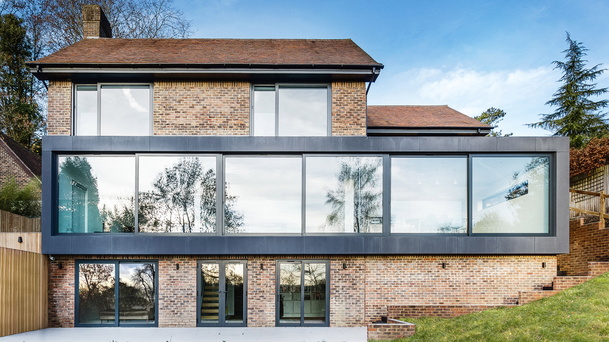 AR Design Studio adds glazed extensions to 1970s house in England