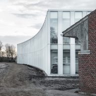 Sleth extends postmodern town hall in Denmark with curving glass volumes
