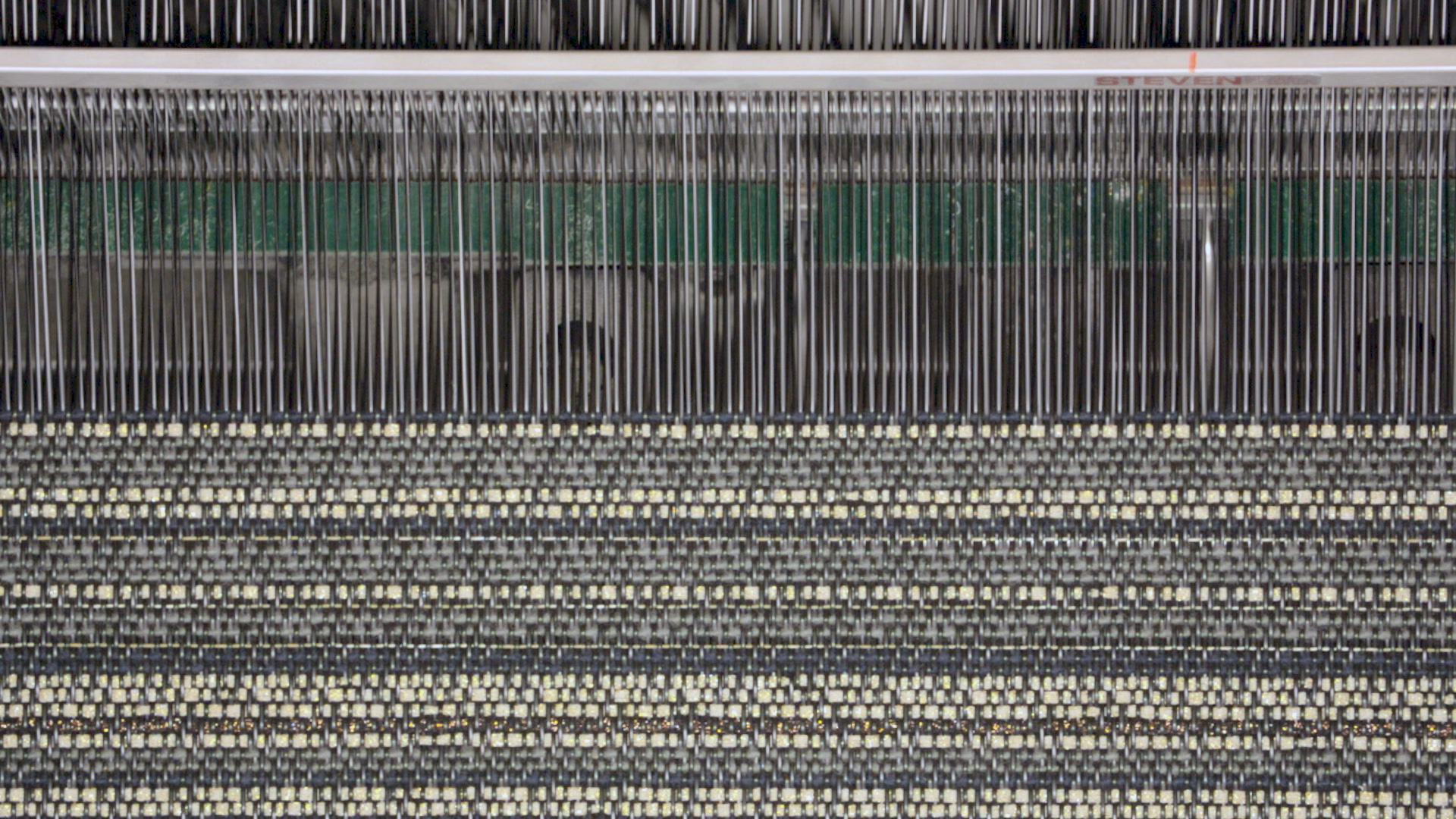 Loom weaving vinyl thread together with other textiles such as wool or cotton